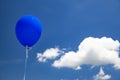 Blue baloon flying in the sky