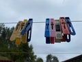 The blue baptismal. Wash things. clothesline. Clothes pegs. Drying things. Multi-colored clothespins. cleaning company Royalty Free Stock Photo