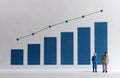 Blue bar graph with flow linear graph. Miniature older people. Royalty Free Stock Photo