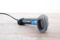 A blue barcode scanner cash register tool on the table Royalty Free Stock Photo