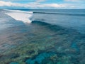 Blue barrel wave in tropical ocean. Aerial view of surfing barrel waves Royalty Free Stock Photo