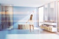 Blue bathroom tub, shower and sink, woman Royalty Free Stock Photo