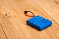 Blue Battery pack on wooden background