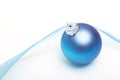 Blue bauble and delicate ribbon Royalty Free Stock Photo