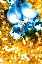 Blue bauble on golden decoration Royalty Free Stock Photo