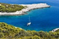 Blue bay with a white sailing boat, Croatia in Europe