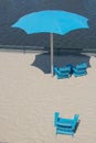 Blue Beach Cahirs annd Umbrella Royalty Free Stock Photo