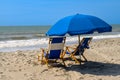 Blue Beach chairs and umbrella at the Atlantic Ocean on a sunny day