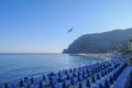 Blue beach chairs and umbrellas on the beach of Monterosso, Cinque Terre, The Ligurian Sea, Liguria, Italy, Italian Riviera Royalty Free Stock Photo