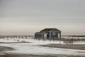 Blue Beach House on Snow-covered Dune Royalty Free Stock Photo