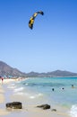 Blue beach with people and kite surf in a summer day