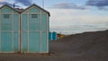 Blue beach sheds near a sand dune on the Mediterranean sea coast Italy, Europe Royalty Free Stock Photo