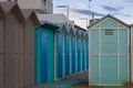 Blue beach sheds on the sand in a winter day Italy, Europe Royalty Free Stock Photo