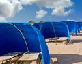 Blue Beach Shelters Under Sky