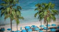 Blue Beach Umbrellas on a Tropical Shore Royalty Free Stock Photo