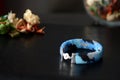 Blue beaded bracelet camouflage coloring on a dark background Royalty Free Stock Photo