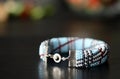 Blue beaded bracelet on a dark background Royalty Free Stock Photo