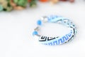 Blue beaded bracelet with greek ornament Royalty Free Stock Photo