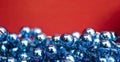Blue Beads on a Red Background. Copy Space for Text. Macro Close-up. Background of Many Colored Beads Necklace Royalty Free Stock Photo