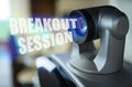 A blue beam glows from the projector inside which is the inscription - Breakout Session Royalty Free Stock Photo