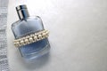 Blue beautiful glass transparent fashionable glamorous bottle of cologne, perfume with white gems and a place for a simple text Royalty Free Stock Photo