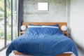 Blue Bed in Cement Room Royalty Free Stock Photo