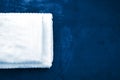 Blue bedspread and white towels on it, bed linen in blue tones, bedroom furniture Royalty Free Stock Photo