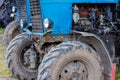 blue belarussian tractors, wheels and opened diesel engine compartments view Royalty Free Stock Photo