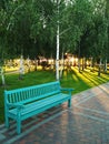 Blue bench in the park Royalty Free Stock Photo