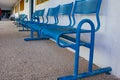 Blue bench in school yard Royalty Free Stock Photo