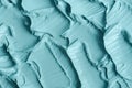 Blue bentonite facial clay (alginate mask, face cream, body wrap) texture close up, selective focus. Abstract background Royalty Free Stock Photo