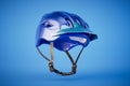 blue bicycle helmet isolated on blue background. 3d render Royalty Free Stock Photo