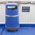 Blue bin on deck of cruise liner Royalty Free Stock Photo