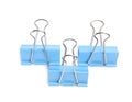 Blue binder clips on white, top view. Stationery item