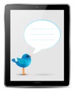 Blue bird with speech bubble in screen of computer Royalty Free Stock Photo