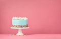 Blue Birthday Cake on Pink Background Royalty Free Stock Photo