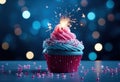 a blue birthday cupcake with a sparkler in the middle Royalty Free Stock Photo