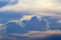 Blue and black clouds interspersed with large white clouds floating in the sky in the atmosphere after the evening rain. There was Royalty Free Stock Photo