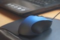 Blue-black PC mouse with joint-friendly mouse-pad Royalty Free Stock Photo