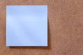 blue blank post it note sticked to wooden memory board Royalty Free Stock Photo