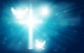 Glowing Christian cross with three white doves, blue light