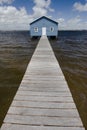 Blue boat house on river