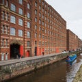 Blue boat passes Royal Mill Royalty Free Stock Photo