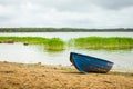 Blue boat on sandy shore. Hamina camping, Finland, Suomi