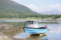 Blue boat in sea water for tranquility calm peace and mindfulness in Argyll and Bute Royalty Free Stock Photo