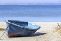 A blue boat standing on the beach Royalty Free Stock Photo