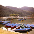 Blue boats on the lake - vintage effect. Colorful retro photo. Royalty Free Stock Photo