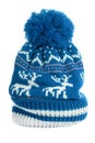 Blue bobble ski hat isolated white vertical reindeer pattern wool warm Royalty Free Stock Photo