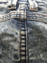 Blue boiled vintage jeans with pockets, stitches, straps and fittings.