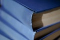 Blue books. Old battered covers of thick volumes of books